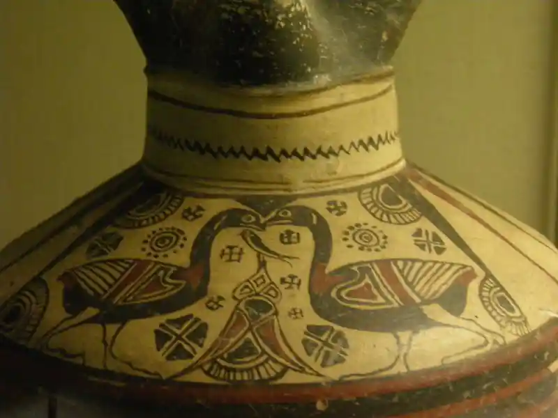 Solar discs, four-point crosses, and geese designs on a jug Solar discs, four-point crosses, and geese designs on a jug
